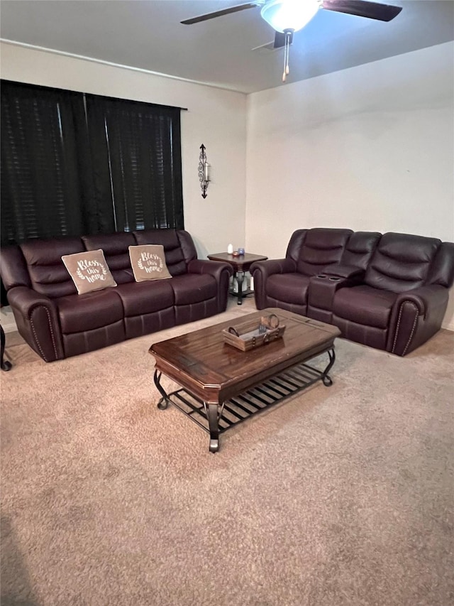 carpeted living room featuring ceiling fan