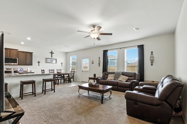 22052 Angelico Dr, Magnolia, TX 77355 - living room with ceiling fan, light carpet, and recessed lighting