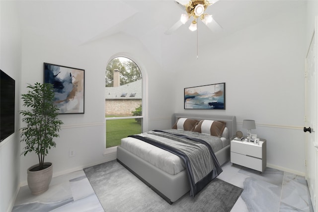 bedroom featuring baseboards, vaulted ceiling, and a ceiling fan