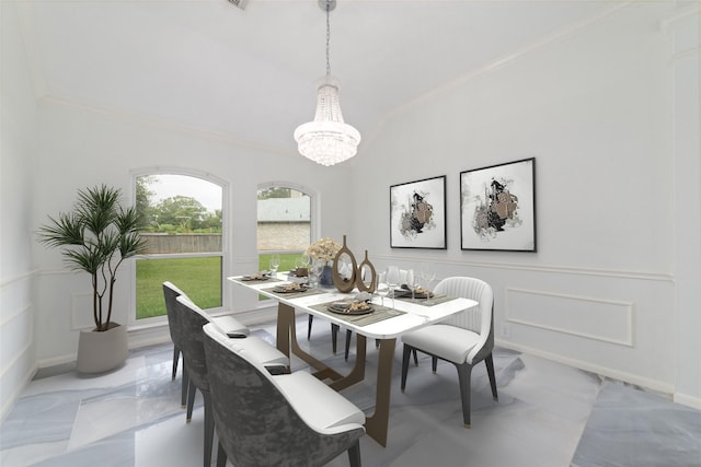 dining room featuring baseboards, ornamental molding, marble finish floor, a decorative wall, and a notable chandelier