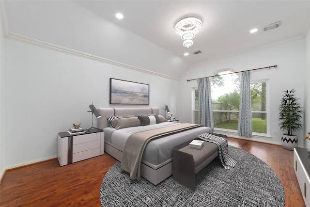 bedroom featuring wood-type flooring, visible vents, vaulted ceiling, and baseboards