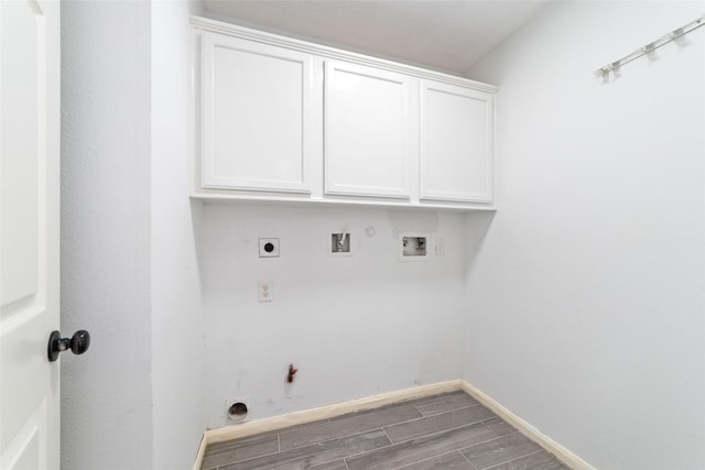 washroom featuring washer hookup, hookup for a gas dryer, wood tiled floor, hookup for an electric dryer, and baseboards