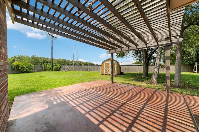 view of patio / terrace featuring an outbuilding, a pergola, a fenced backyard, and a storage unit