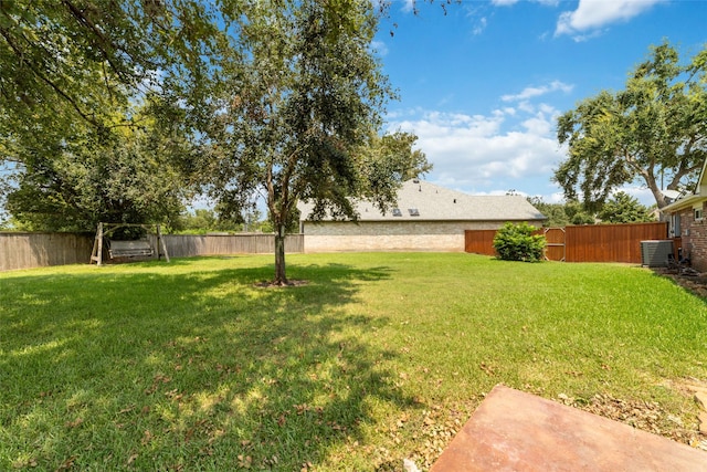 view of yard featuring a fenced backyard and cooling unit