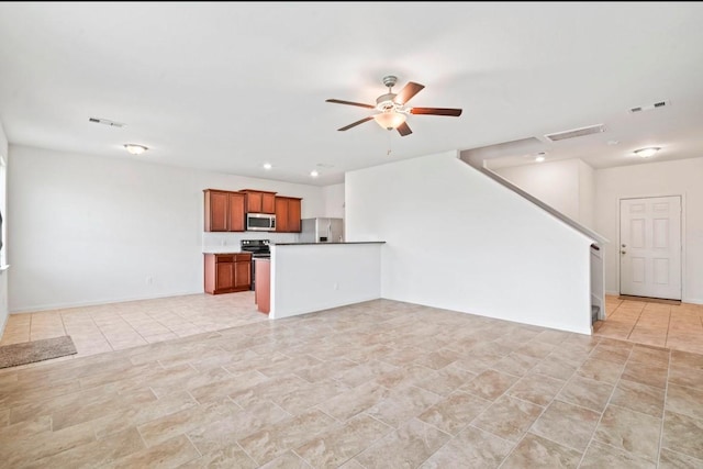 unfurnished living room with a ceiling fan, recessed lighting, and visible vents