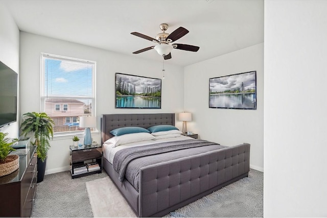 bedroom with carpet flooring, ceiling fan, and baseboards