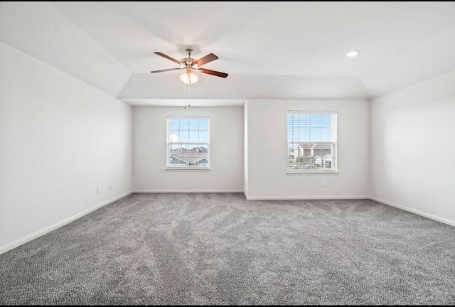 spare room with baseboards, a healthy amount of sunlight, and carpet flooring