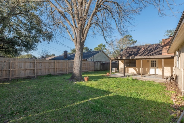 view of yard featuring a fenced backyard and a patio