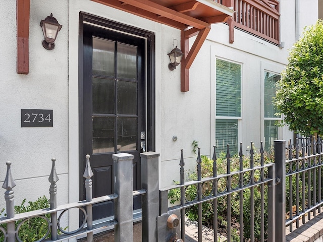 doorway to property with stucco siding