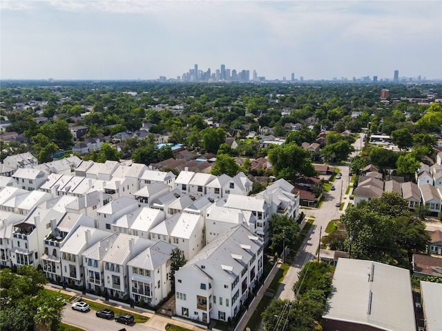 birds eye view of property featuring a city view