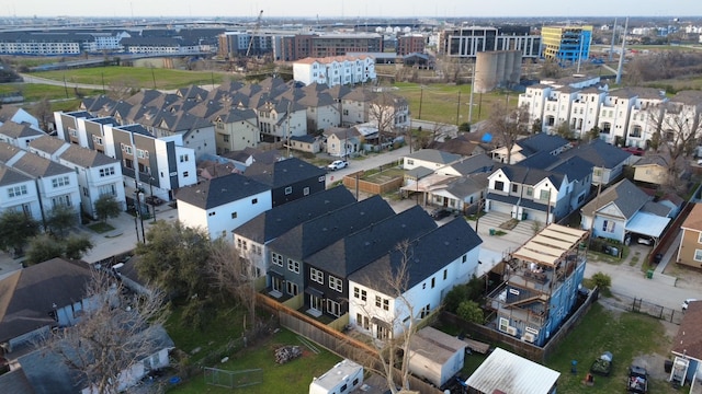 birds eye view of property with a residential view