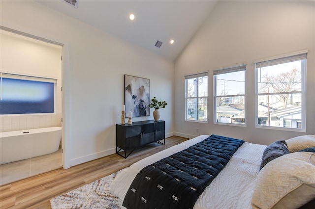 bedroom featuring high vaulted ceiling, recessed lighting, wood finished floors, visible vents, and baseboards