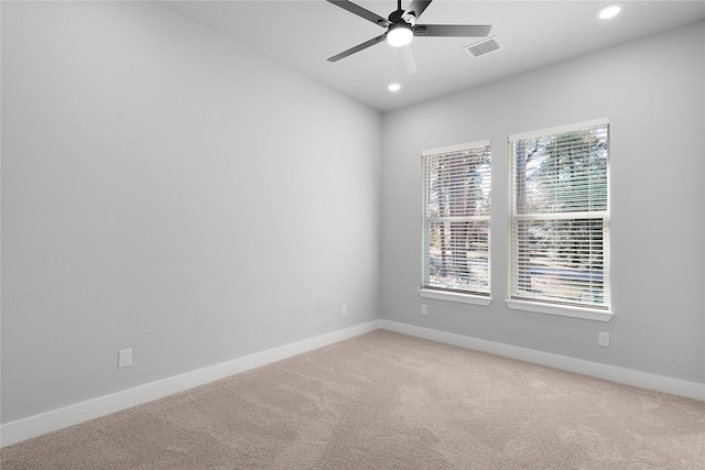 spare room with visible vents, baseboards, a ceiling fan, light colored carpet, and recessed lighting