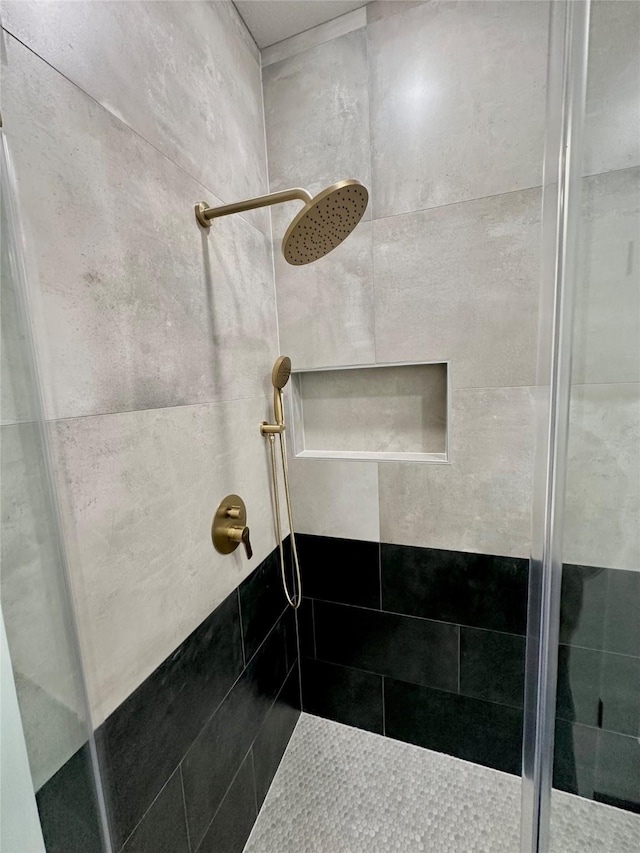 bathroom featuring a shower stall