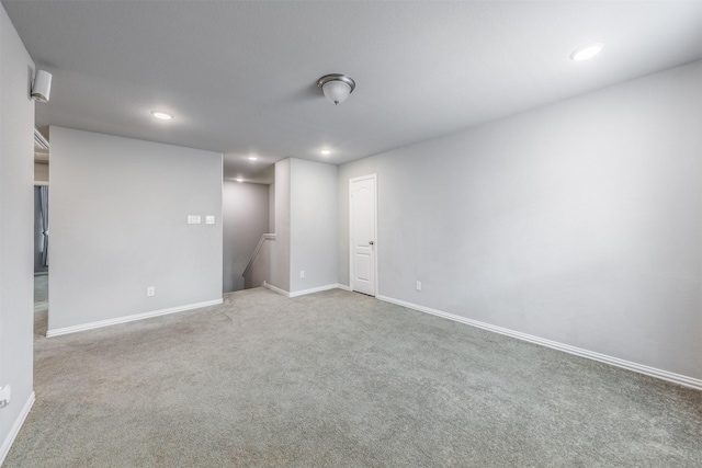 unfurnished room featuring carpet floors, recessed lighting, and baseboards