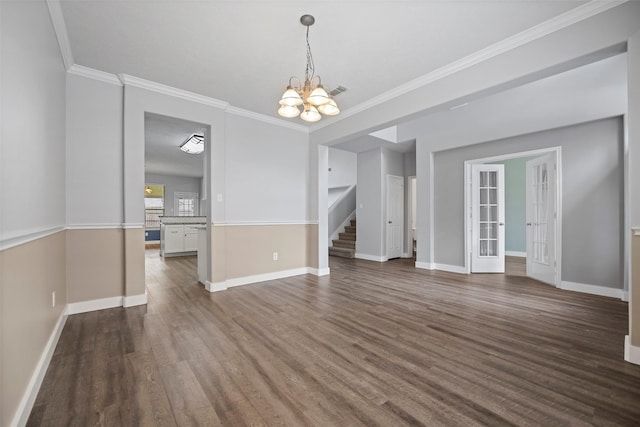 interior space featuring dark wood-style floors, crown molding, baseboards, and a notable chandelier