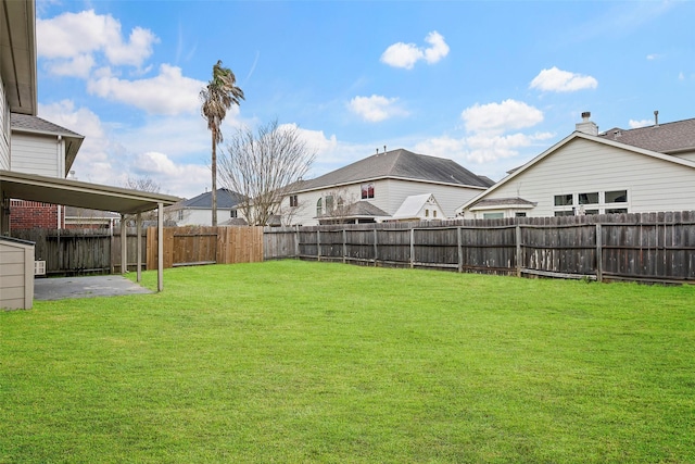 view of yard with a patio area and a fenced backyard