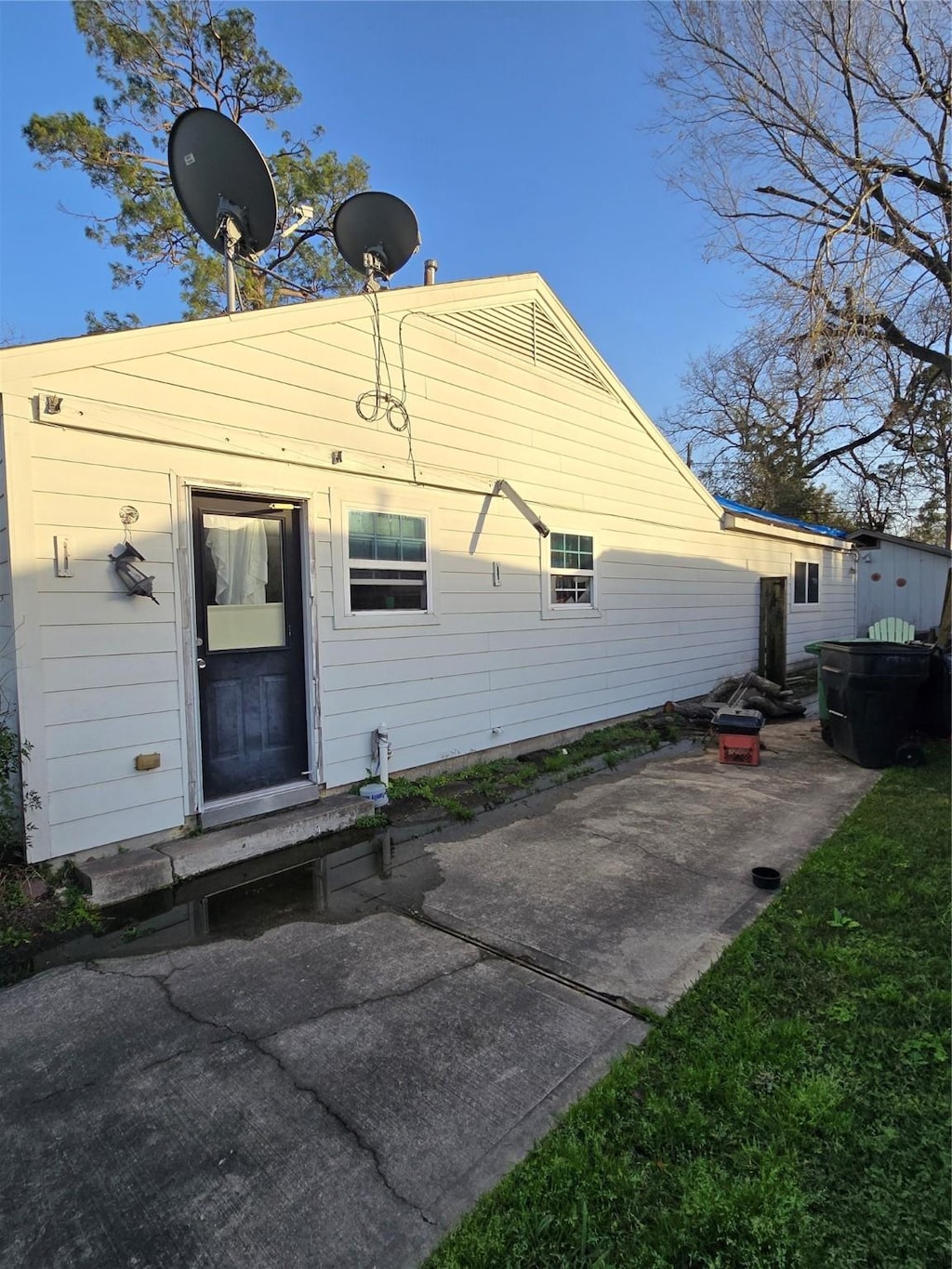 rear view of property featuring a patio