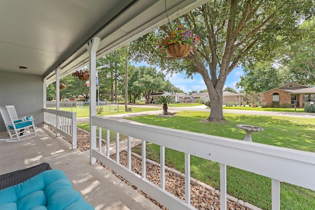 balcony featuring a residential view and covered porch