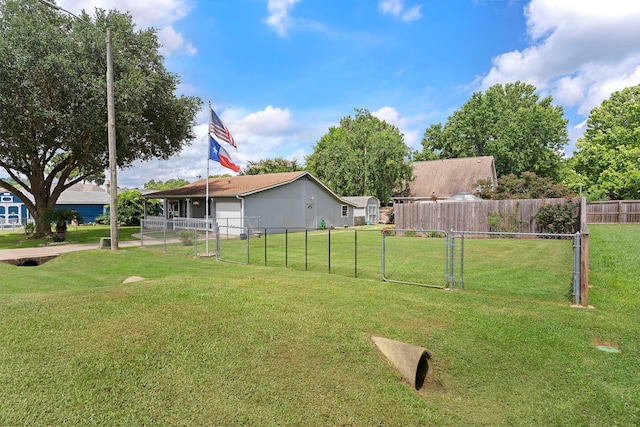 view of yard with a gate and fence