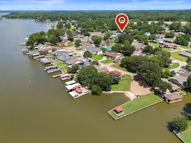 birds eye view of property with a residential view and a water view