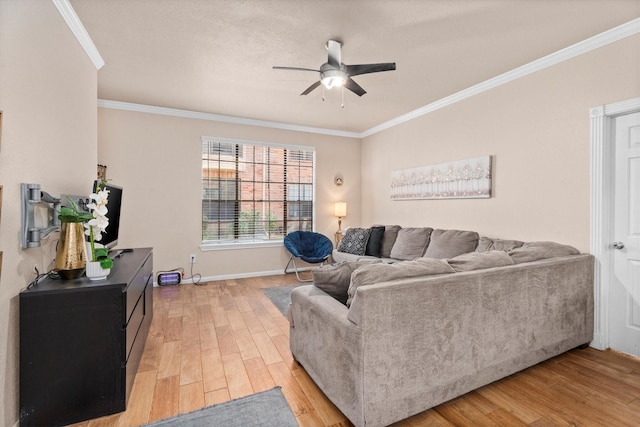 2255 Braeswood Park Dr Unit 265, Houston, TX 77030 - living area featuring a ceiling fan, light wood-style flooring, crown molding, and baseboards