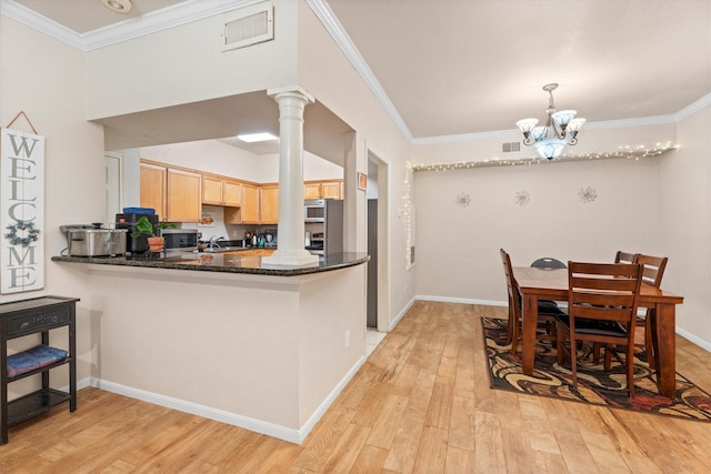 2255 Braeswood Park Dr Unit 265, Houston, TX 77030 - kitchen featuring decorative columns, light brown cabinets, a chandelier, light wood-style flooring, and ornamental molding