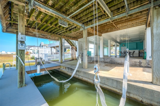 view of dock with a water view and boat lift