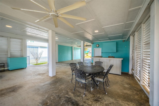 dining space featuring unfinished concrete floors