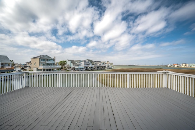 wooden terrace featuring a residential view