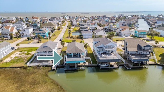 birds eye view of property featuring a water view and a residential view