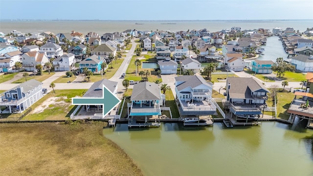 bird's eye view featuring a residential view and a water view