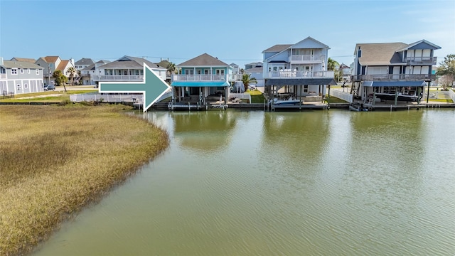 dock area with a water view and a residential view