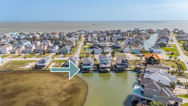 bird's eye view with a water view and a residential view