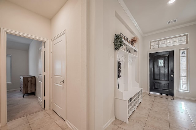 mudroom featuring crown molding, light tile patterned floors, recessed lighting, visible vents, and baseboards