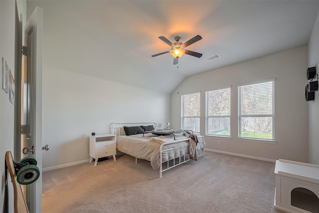 bedroom with carpet floors, lofted ceiling, visible vents, and baseboards