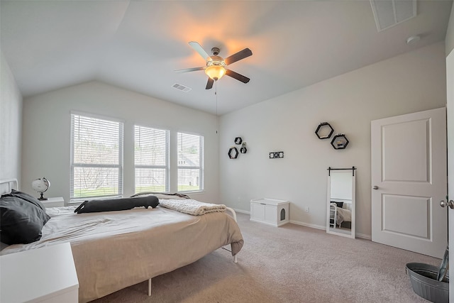 bedroom with lofted ceiling, carpet, visible vents, and baseboards