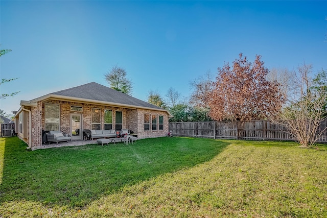 exterior space with an outdoor hangout area, a patio area, and a fenced backyard