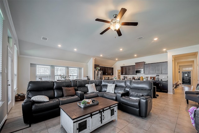 living area featuring lofted ceiling, visible vents, crown molding, and light tile patterned floors