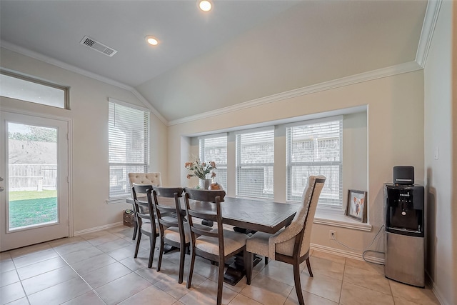 dining space featuring vaulted ceiling, baseboards, visible vents, and crown molding