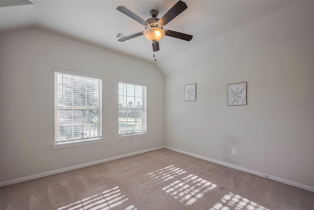 unfurnished room with lofted ceiling, baseboards, visible vents, and carpet flooring