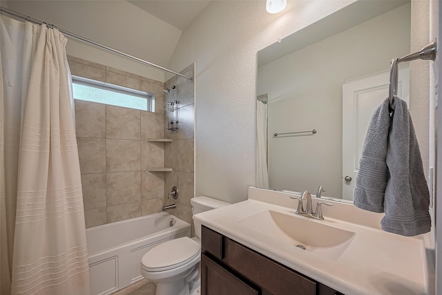 bathroom with toilet, a textured wall, shower / bath combination with curtain, and vanity