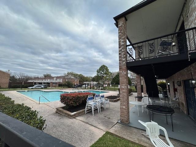 community pool with a patio