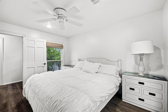 bedroom featuring access to exterior, a ceiling fan, visible vents, and wood finished floors