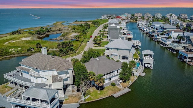 bird's eye view with a residential view and a water view