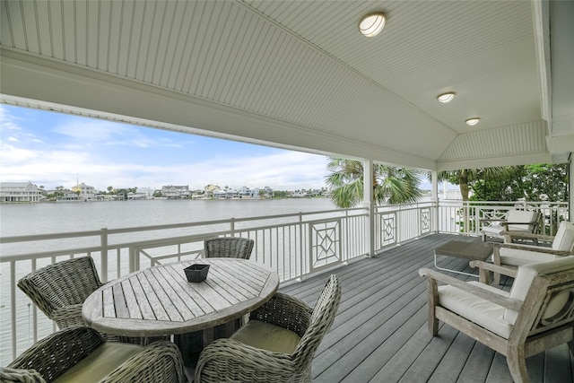 wooden terrace with a water view