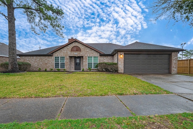 view of front of home featuring brick siding, concrete driveway, fence, a garage, and a front lawn