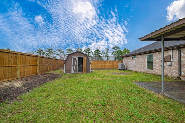 view of yard featuring a shed, an outdoor structure, a fenced backyard, and central air condition unit