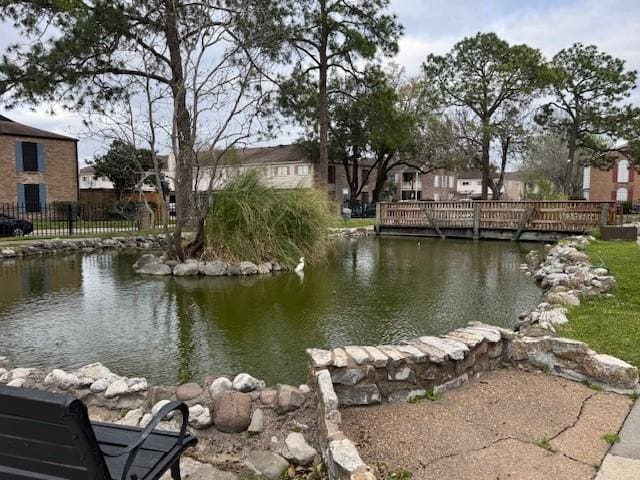 view of water feature featuring fence