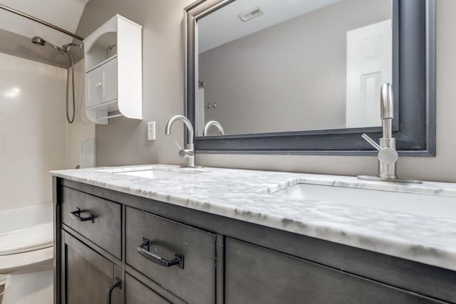 full bathroom featuring toilet, visible vents, a shower, and vanity